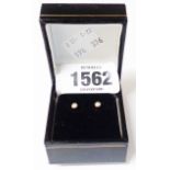 A pair of small diamond stud ear-rings - boxed