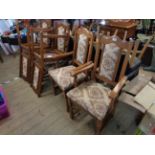 A set of six vintage Old Charm oak panel back dining chairs with upholstered seats, set on turned