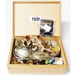 A wooden box containing assorted costume jewellery and two plated decanter labels