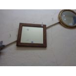 A small oak framed oblong mirror