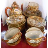 An early 20th Century Japanese eggshell porcelain part tea set with Imari style decoration and