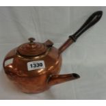 An early 20th Century copper coffee pot with hinged lift-up lid and wooden side handle