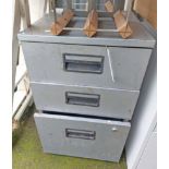 A three drawer filing cabinet with gunmetal finish
