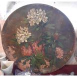 Three large Watcombe Torquay terracotta platters, the largest decorated with a floral still life