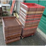 A quantity of fifty plastic stacking shallow apple crates with metal dolly