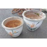 Two ceramic garden planters decorated with floral sprays