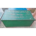 An old metal bound plywood trunk with lift off top and leather side handles (one missing) with a