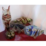 Four Murano glass fish ornaments comprising three standing and one upright vase form, all