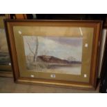 LBB: a gilt framed and slipped watercolour, depicting a winter lakeland landscape - signed