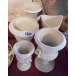 Six white glazed Dartmouth pottery vases of various shape and style