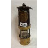 An old Hail Woods Approved miner's lamp made by A & K Boyd and Best Ltd of Morley, Leeds of steel