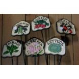 A set of six modern cast iron vegetable labels