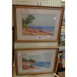 A pair of gilt framed watercolours, both depicting coastal views - indistinctly signed