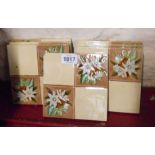 Seven Victorian tiles with moulded barbotine style decoration