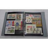 A blue ring bound stock album containing a collection of mint GB mainly decimal stamp packs and