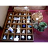 A collection of decorative thimbles in a display rack - sold with a Wade porcelain chimpanzee posy