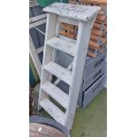 A small wooden four step stepladder with later painted finish