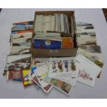 A shoe box containing a large collection of early to mid 20th Century assorted postcards including