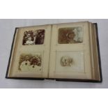 An late Victorian half bound photograph album containing a Westcountry family collection of