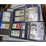 Five albums containing mid to late 20th Century GB royalty interest FDCs - sold with one empty album