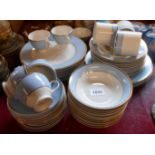 A selection of modern Royal Doulton Regency Gold tea and dinner ware including cups and saucers,