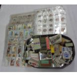 A box containing a collection of loose and sleeve mounted cigarette cards, also others in