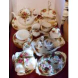 A quantity of Royal Albert Old Country Roses tea and dinner ware including six place tea set, dinner