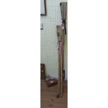 A 12' 10" vintage lacquered bamboo thre A 12' 10" vintage lacquered bamboo three section fishing rod