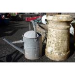 An old ceramic chimney pot of cannon form - sold with a galvanised watering can