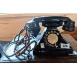 An old Bakelite telephone with original wiring