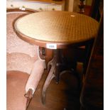 A reproduction bentwood tripod table with rattan top