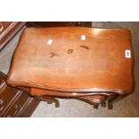 A nest of three inlaid walnut style tea tables with carved and moulded decoration