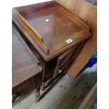 A Victorian mahogany pot cupboard with panelled door, set on turned legs