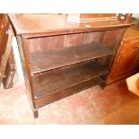 A 1.05m mahogany three shelf open bookcase with moulded top and block ends