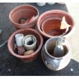 A selection of terracotta plant pots, etc.