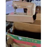 A vintage Singer Sew Handy child's sewing machine in original box