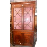 A 1.1m 19th Century mahogany and strung two part corner cabinet with astragal glazed top section
