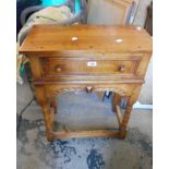 A 60cm polished oak side table in the antique style with frieze drawer and carved apron, set on ring