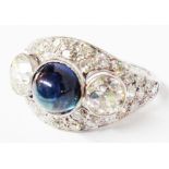 A marked PLAT 1920s style ring, set with central cabochon sapphire with flanking collar set