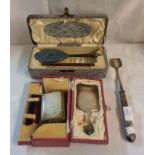 A cased vintage silver mounted small hand mirror, brush and comb set with engine turned decoration -