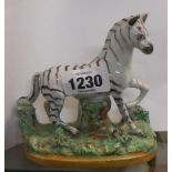 A 19th Century pearlware Staffordshire figure depicting a zebra