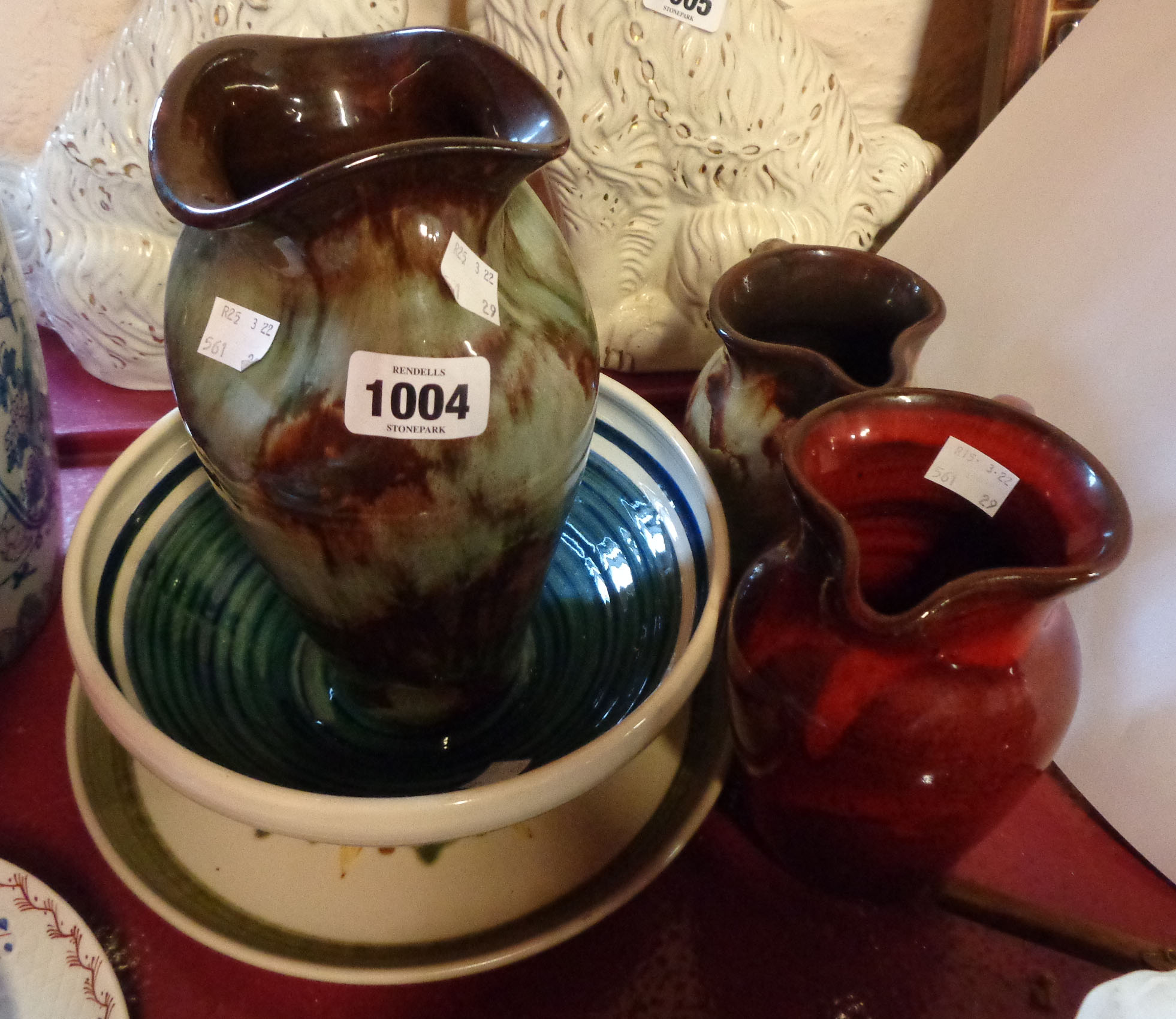 Three pieces of Ewenny pottery with mottled streaky glaze effect - sold with a dragon pottery bowl