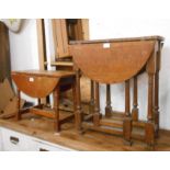 Two small stained oak drop-leaf tables, one gated, the other with swivel top, both set on turned