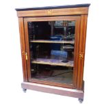 A 79cm late Victorian inlaid mahogany pier cabinet with velvet lined interior enclosed by a glazed