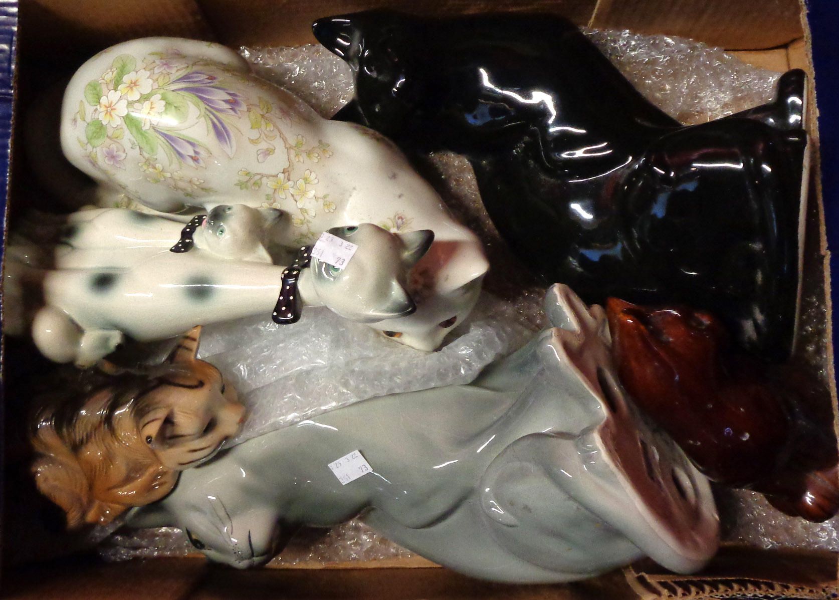 A box containing a quantity of pottery cats including China Blue, etc.