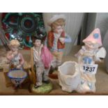 Four continental porcelain figurines