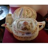 An early 19th Century Staffordshire bone china part tea set comprising teapot, two cups and saucers,