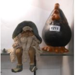A studio pottery shelf edge figure of a gnome with glazed hat and shoes (one shoe a/f) - sold with a