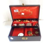 A concertina action jewellery box containing a quantity of assorted costume jewellery