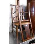 Two rattan seated standard chairs, one with high wheel back, the other a panel back